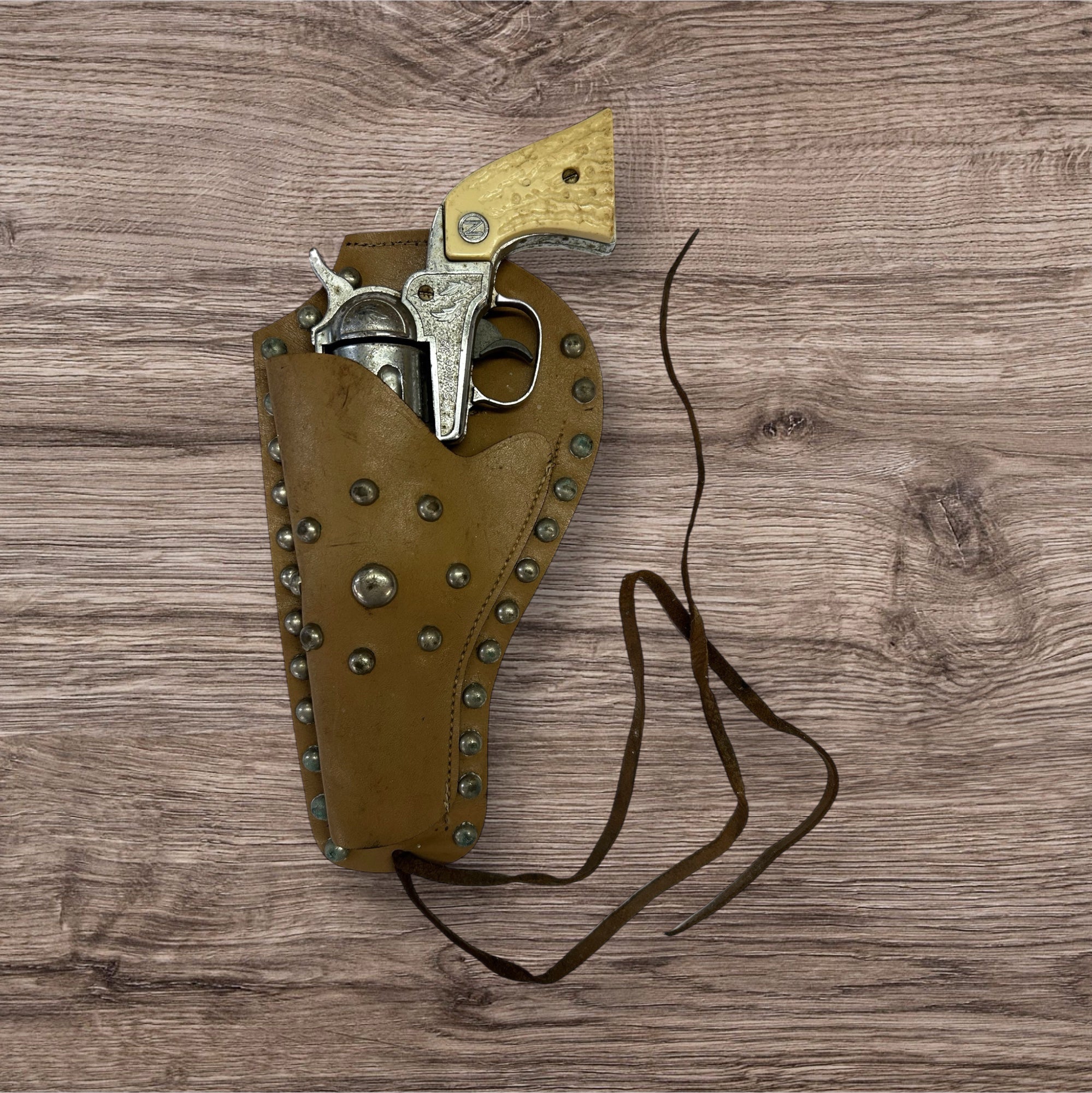 Nichols Stallion 38 cap gun with leather holster VINTAGE 1950'S | Finer Things Resale